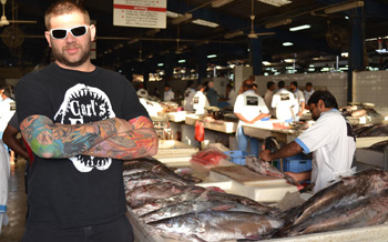 First Watch's corporate chef, Shane Schaibly, visits a fish market. Schaibly plans to work with suppliers to provide more local ingredients at the chain.