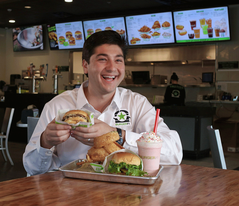 burgerfi-chief-brand-development-officer-charlie-guzzetta.gif