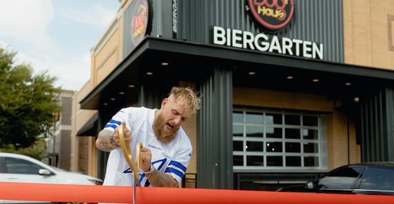 Jake Paul cutting the ribbon for Dog Haus opening