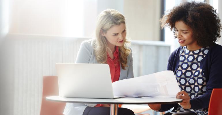 business women looking at paper.jpg