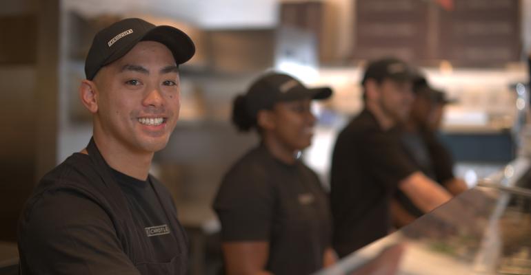 Chipotle workers inside a restaurant