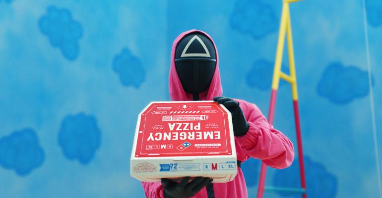 Squid Games guard holding an Emergency Pizza