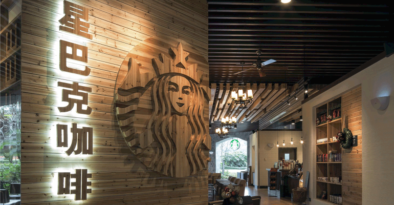 Interior of a Starbucks China with the logo made of wood