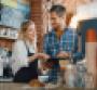 Smiling employees in a cafe setting