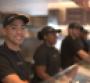 Chipotle workers inside a restaurant