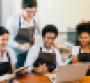 Restaurant employees smiling in a group