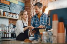 Smiling employees in a cafe setting