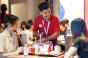 A Chick-fil-A worker talking to a customer