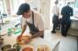 A restaurant employee making food