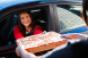 Pizza Hut drive-through, customer in car receiving pizza